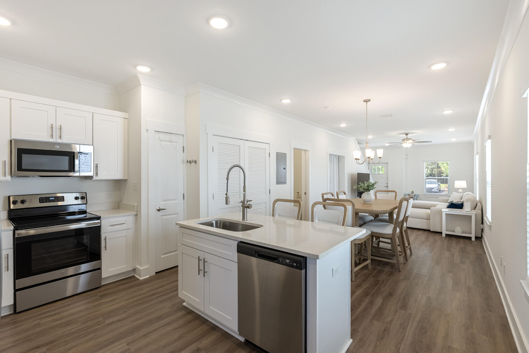 Welcome to your new coastal retreat located in the beautiful community of Verandas at Freeport! This beautifully maintained 3-bedroom, 2.5-bath townhome is being sold fully furnished, offering a truly turnkey opportunity for full-time living or investment property. Step inside to a spacious open floorplan, perfect for entertaining or relaxing. The modern kitchen boasts quartz countertops, stainless steel appliances, and a generous island overlooking the brightand airy living and dining areas. Enjoy easy maintenance and upscale style with luxury vinyl plank flooring throughout the main living spaces. Upstairs, you'll find a large primary suite with a private en-suite bath, along with two additional bedrooms and a second full bath. A convenient half-bath is located on the main level.