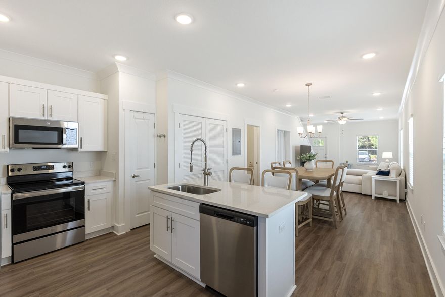 Welcome to your new coastal retreat located in the beautiful community of Verandas at Freeport! This beautifully maintained 3-bedroom, 2.5-bath townhome, offering a truly turnkey opportunity for full-time living or investment property. Step inside to a spacious open floorplan, perfect for entertaining or relaxing. The modern kitchen boasts quartz countertops, stainless steel appliances, and a generous island overlooking the brightand airy living and dining areas. Enjoy easy maintenance and upscale style with luxury vinyl plank flooring throughout the main living spaces. Upstairs, you'll find a large primary suite with a private en-suite bath, along with two additional bedrooms and a second full bath. A convenient half-bath is located on the main level. Furniture is negotiable!