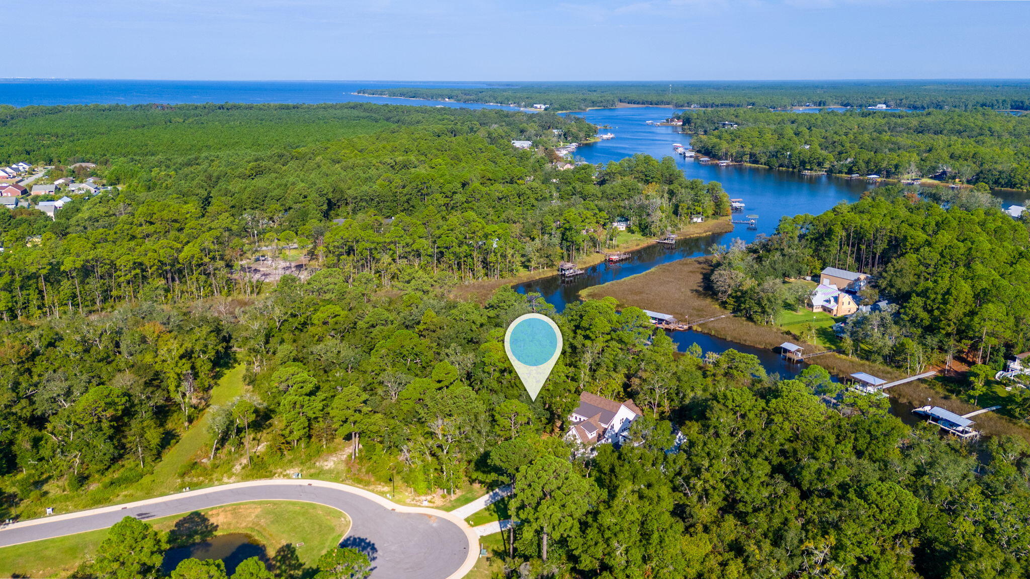 1/2 Acre Waterfront lot with New dockage. Build to suit in the newest Gated Community in Freeport . Experience the unique waterfront lifestyle with direct boating access from your backyard to the bay. Live amongst the natural beauty of the coastal environment and build your private retreat. Lot size is .47 acres. Redfish Point is minutes from the white sand beaches, restaurants shops and parks of South Walton County.
