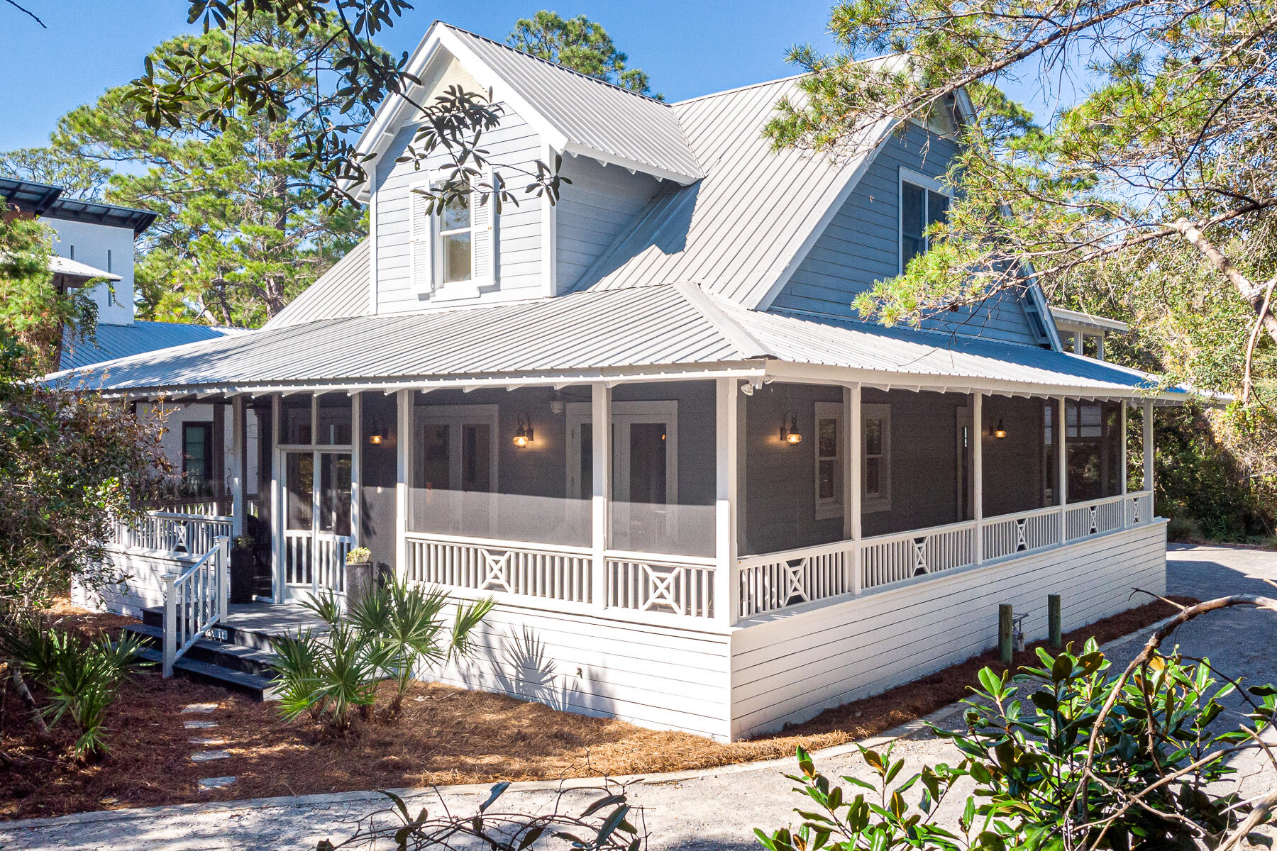 Located in the much desired, coastal dune lake neighborhood of Lakeplace at Grayton Beach, this charming home is the perfect full time residence or vacation getaway. Lakeplace at Grayton Beach is a beautiful, 20 acre, rental restricted, gated community located south of 30A. Set back in the trees and surrounded by native landscaping, this home offers privacy on every side. The main house features an amazing wrap around screened in porch, a large eat in kitchen, built in bookcases, 2 bedrooms & bath on the first level with master suite and extra loft space upstairs. Recently built in 2018, the guest cottage, located above the two car garage, features a full kitchen, light filled living room & bedroom space and large private porch.