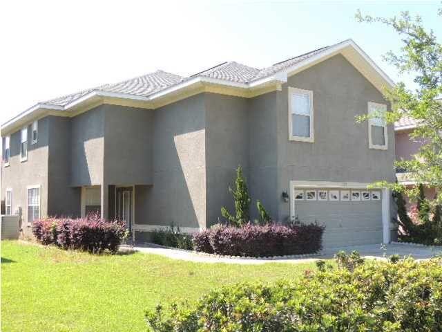 Welcome to Driftwood Estates, one of the area's most sought-after communities known for its charm, mature landscaping, and strong sense of neighborhood pride. As you arrive, you'll notice the widened driveway with elegant paver accents and manicured landscaping that sets the tone for this beautifully updated two-story stucco home. Featuring 4 bedrooms and 3 bathrooms, the home has been freshly repainted inside and out, and a brand-new roof was installed in June 2025. Inside, an open-concept layout welcomes you with abundant natural light pouring in through multi-level windows, connecting the spacious living and dining areas. The updated kitchen features granite countertops, a tile backsplash, stainless steel appliances, and a gas stove powered by an above-ground tank. A Culligan water softener and a walk-in laundry room add to the convenience. The fourth bedroom and a full bath are located on the main floor, ideal for guests or a home office. A stair chair provides access to the second floor, where one bathroom includes a stand-up tub for those with limited mobility. Two bedrooms and a full bath are positioned at one end of the upstairs, while the spacious master suite offers a renovated bath with a glass shower, private water closet, and a hidden second washer/dryer. Step out back to a fully screened-in porch with ceramic tile, lighting, and an automatic screen. The beautifully landscaped yard is a gardener's dream, filled with lush greenery and vibrant blooms.