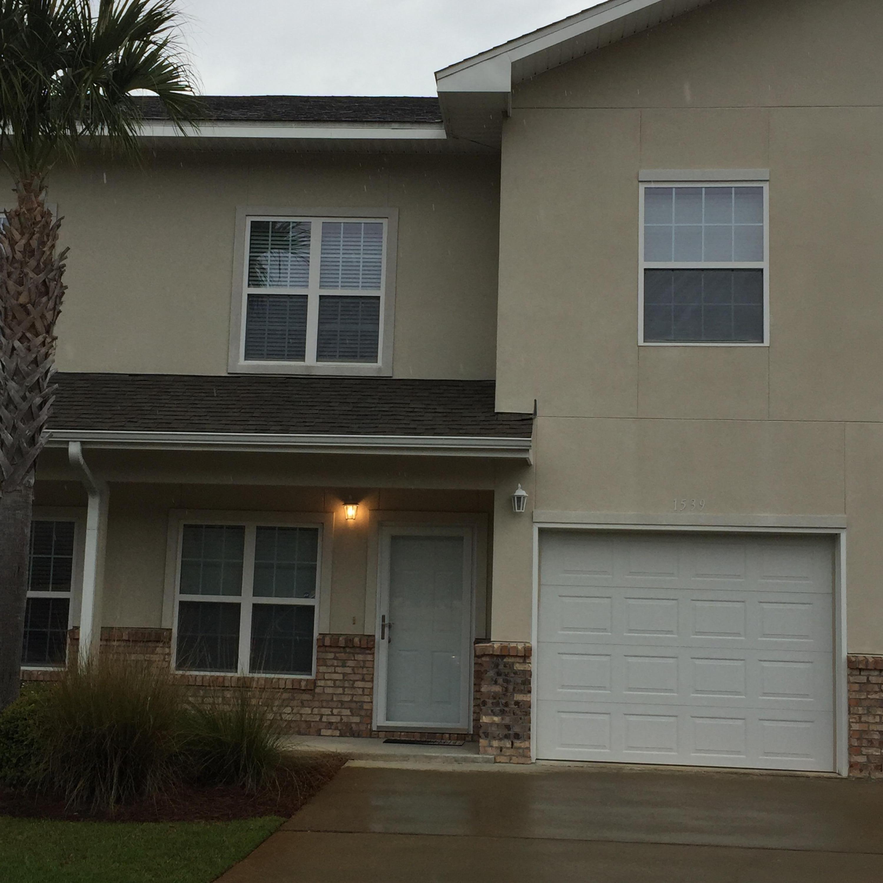 This upgraded townhome is beautiful inside and convenient to Hurlburt and Eglin AFB's. Located less than a mile from the east gate of Hurlburt Fld, Meridian Square Townhomes is an executive-style townhome community offering beautiful homes in a low-maintenance setting; the HOA takes care of all lawn maintenance. This home features a beautiful hardwood floor downstairs in the family room and dining room, and tile in the kitchen, entryway and baths. The kitchen is outstanding with hard rock maple cabinetry and granite countertops. All bath countertops are granite, too. The laundry room is large, and there is storage galore in this home, with a pantry and closet downstairs, along with lots of bath cabinets, walk-in master closet, deep extra bedroom closets, and linen closet upstairs.