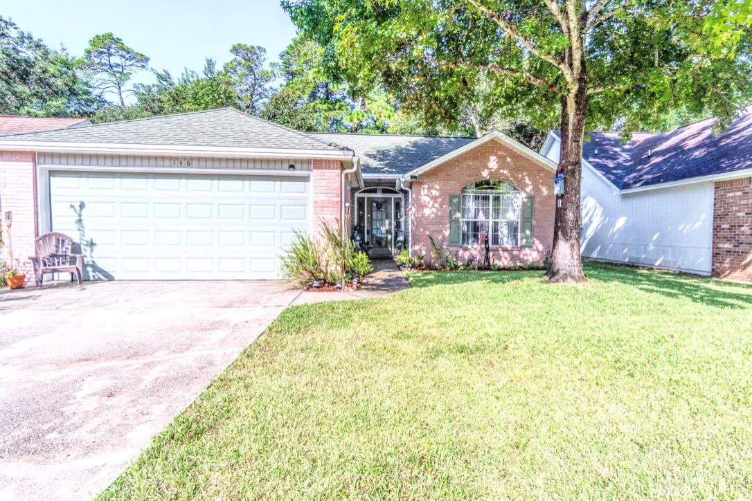 Pride of ownership shows from the minute you pull into the driveway of this lovely well maintained home in the Bluewater Bay area. As you enter the large living room with cathedral ceilings you'll find a wood burning fireplace and plenty of natural light from the skylights. Just off the living room is a heated and cooled Florida room overlooking a nice sized private backyard with fruit trees. The kitchen has been updated with painted cabinets, newer stainless steel appliances and good size breakfast bar and dining area. Within walking distance to restaurants, shopping and fitness centers. Only a short drive to the beautiful beaches of Destin, Eglin AFB, Duke Field and 7th Group. This home features, sprinkler system with rain sensor and low voltage lawn lighting. Selling As-Is.