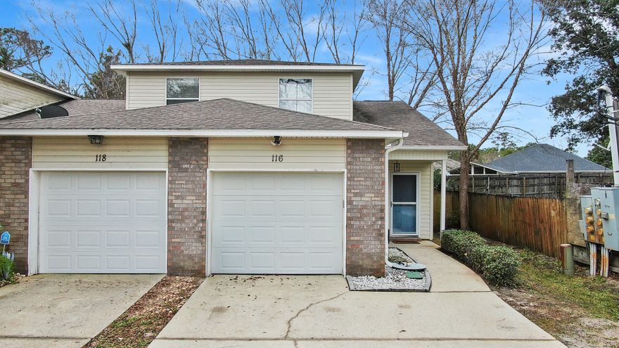 Motivated Seller and No Homeowners Association! Wonderful location! Recent improvements include new HVAC system, water heater, laminate flooring, and carpet on stairs . End unit with  2 large driveway spaces  for you or your guests/roommate and an attached 1-car garage. Just 2.2 miles from Hurlburt Field. Impeccably maintained property, freshly painted with a roomy kitchen and an open living space. The main areas showcase beautiful porcelain tile floors for easy maintenance. The primary bedroom is spacious with a walk-in closet and access to the 4-season room. Privacy is ensured with a split bedroom layout, providing ample space for everyone.