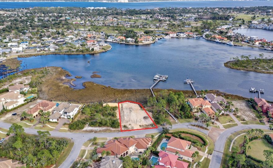 Welcome to the Finisterre! This Bayfront lot is ready for you to start building your waterfront dream home. This lot has been built up and is complete with a brand new seawall. Your future dream home is 5,070sqft and will feature an expansive master retreat with fabulous outdoor space, three additional ensuite bedrooms and a powder room. Enjoy the home gym, gourmet kitchen and wine cellar, just to name a few highlights of this luxurious home. Finisterre is a small gated community located on lower grand lagoon in Panama City Beach. Residence of this prestigious community can enjoy tennis, a community boat dock, a basketball court and playground. You are a short drive to all of the popular sights and sounds that make Panama City Beach famous!