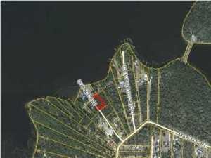 This lot is about 200 feet from the lake and very near common fishing dock and boat ramp for residents use. The lot is wooded and fronts Swanee. This is a great home site in a good area of Lake Holley. Lake Holley is renown for excellent fishing especially pan fish like bream and bass. All information must be verified by buyer (measurements and utilities). Septic System is needed. Net acreage without road easements is about 0.367 acres.