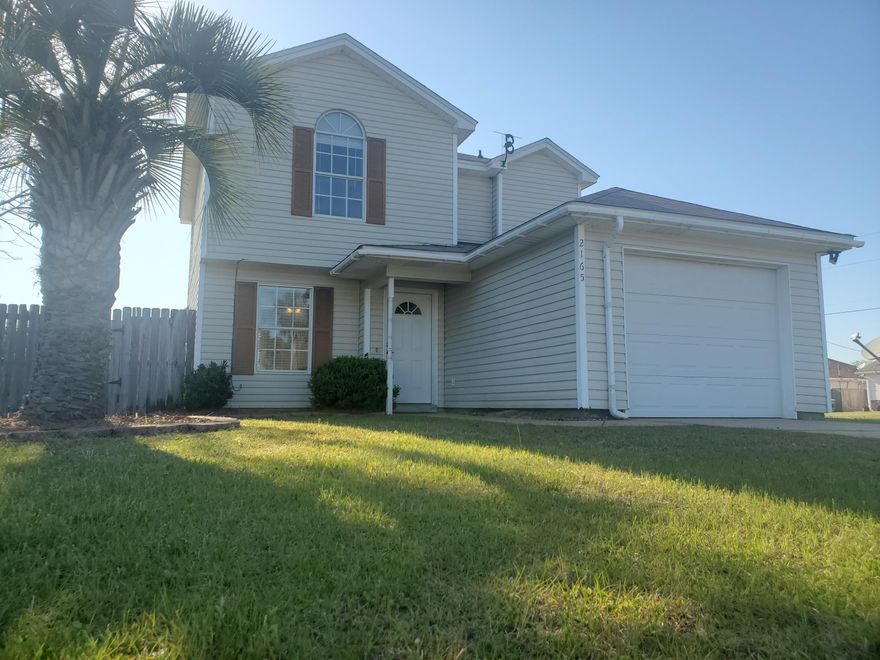 New Roof in 2018!!! Enjoy many peaceful mornings and evenings from the comfort of this spacious Florida room.  This 2-story home showcases a wonderful outdoor space including a Florida room, a fenced backyard, and beautiful landscaping in the front.  The first floor includes a living/dining room combination, tile flooring, and half bathroom.  The kitchen has plenty of storage and views of the backyard and dining area.  All of the bedrooms are located on the second floor, with the owner's suite including its own full bathroom.   The property is just a short drive away from the restaurants and amenities at Navarre Beach.