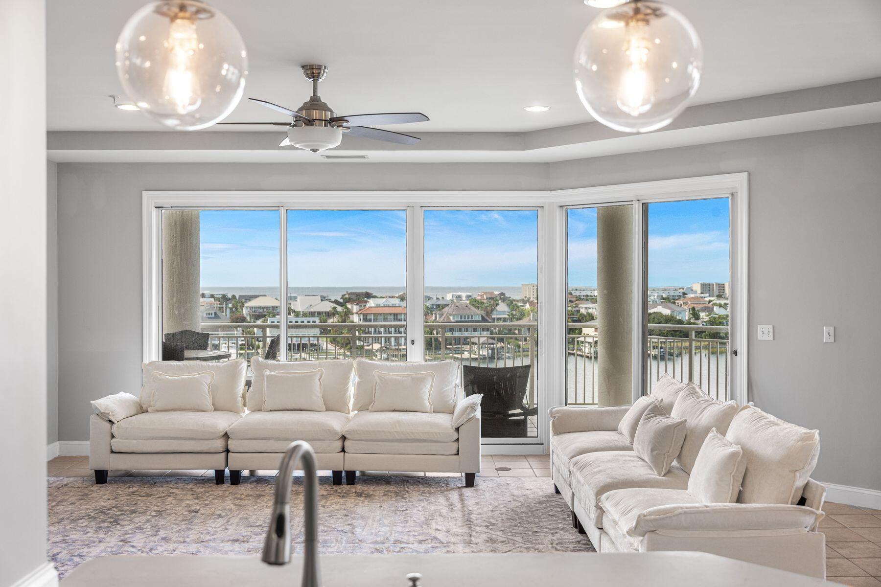 Assumable VA Loan @ 2.75% Perched upon the prime west end of Grand Harbor's 5th floor, this 4BR/4BA residence offers uninterrupted views of both the Gulf of America and the Destin Harbor. The oversized balcony takes in harbor views with the Gulf beyond, and a built-in gas grill ready for sunset dinners. Inside, the living area flows into a remodeled kitchen with quality finishes, while 9.5' ceilings and plantation shutters keep it sharp and coastal.A full wet bar makes entertaining effortless, and every bedroom offers its own private bath. Generously sized rooms and wide sightlines keep the views in focus, with Harbor and Gulf panoramas carrying through the primary suite, guest bedroom, kitchen, living room, and dining area, which can easily convert to an additional living space if preferred.
Within the gates, Grand Harbor is a sanctuary of quiet exclusivity. A secure parking garage, private marina access, fitness center, clubhouse, heated waterfront pool, and a reserved guest suite ensure comfort for owners and their guests. With no short-term rentals permitted, the community remains private, neighborly, and serene.