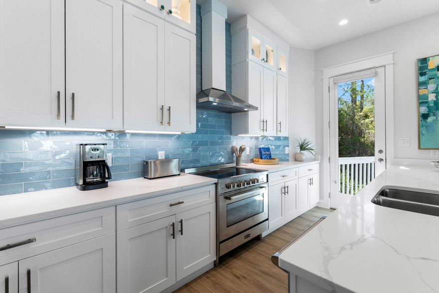 This stunning 3 year old home in the gated community of Treetop Village is offered fully furnished and ready for you to enjoy. Whether you are looking for a primary residence or investment property, 345 Redbud with up to $134K in rental projections will serve you well. Nestled between Alys and Rosemary Beach, this tranquil neighborhood offers the best of both worlds with direct access to both Highway 98 and 30A. The home backs up to a serene wooded area, providing privacy, while also featuring a community pool and deeded beach access, making it the perfect retreat for beach lovers.Inside, you'll find four spacious bedrooms, including  a custom-built bunk room with six bunks, perfect for welcoming  all your favorite people. There is also a FLEX room, that could be used as an office.