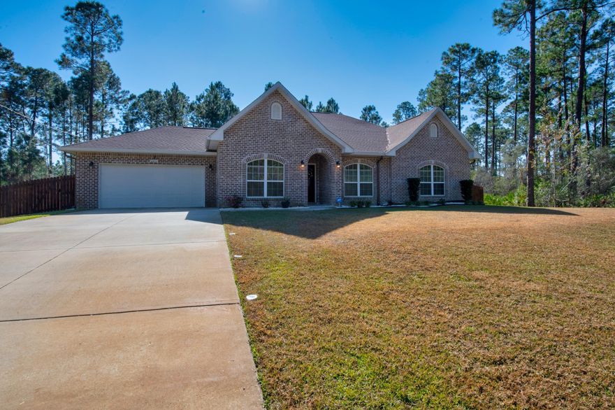 This charming 4 bedroom 2 bath brick home on almost half and acre, located in the Holley By The Sea subdivision is ready and waiting for its new owners! The 2,500+ square foot home still looks like new and includes upgraded flooring! It was built in 2016 and features an open concept living space, vaulted ceilings, throughout the main areas, and roomy bedrooms. The kitchen is gorgeous and includes a breakfast bar that overlooks the great room, a walk-in pantry. The master bedroom and bath include separate his and her vanities, jetted tub, amazing tile shower with glass doors, enormous walk-in closet, and water closet. Gutters have been added to the home and the oversized backyard is great for entertaining or enjoying the day pass by. Stop searching, start living - at home.