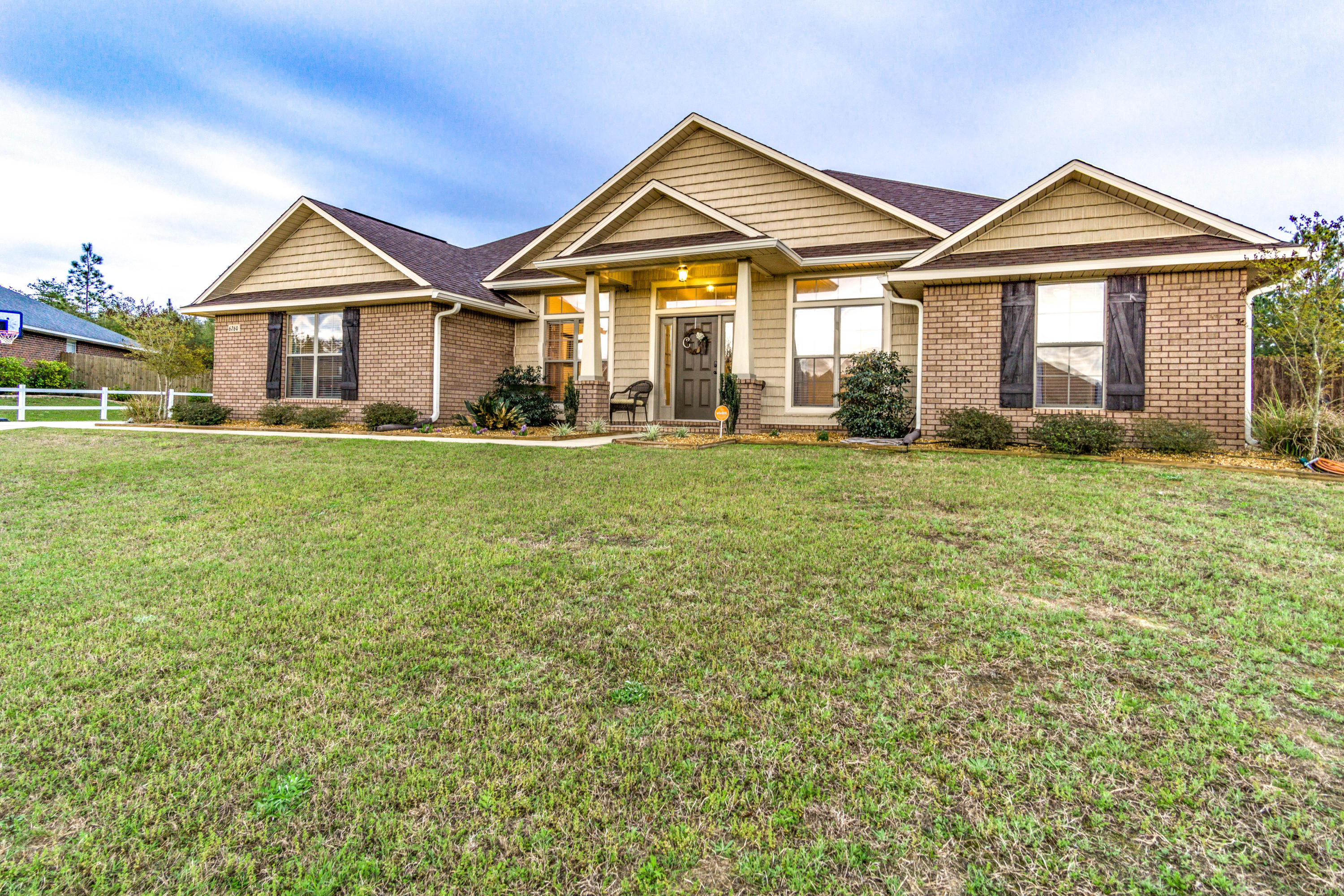 Country feel just minutes from town with no HOA! Less than 30 minutes to Duke AFB/7th group, this 4/3 home is situated on over 1/2 acre flat lot. When you enter the home, you are greeted by a large foyer with office to your right & formal dining area to the left. Continuing in, you will enter a large living room, w/electric fireplace. This home has a split floor plan w/ guest wing that comes complete with large bedroom & private bathroom. The kitchen features an oversized island, stainless steel appliances, ample cabinet space, a walk-in pantry, & granite countertops. The master suite has a trey ceiling, two walk-in closets, & a sliding glass door to the covered porch. Call today for your private tour! SELLER WILL CONTRIBUTE $4000 TO BUYERS CLOSING COSTS. Home has video/audio surveillance