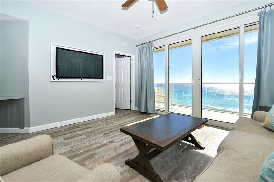 Recently renovated AND VERY CLEAN condo with a relaxed coastal theme with BREATHTAKING, OCEAN-FRONT/VIEWS. Sterling Sands is located DIRECTLY ON THE BEACH. Modern Wood look tile throughout, with no carpet anywhere! The large sliding glass balcony doors in both the Living Room and Master Bedroom directly face the beach affording maximum opportunity to take in the breathtaking views of the sparkling, emerald green waters. You can also see the water from the kitchen while you prepare meals on the granite countertops. The kitchen and both bathrooms feature painted shaker cabinets with soft close drawers. The kitchen has a custom tile backsplash and open shelving for a custom design. Gross rental income in 2018 and 2019 averaged $54,000 per year.  Call today for a private viewing. Sterling Sands Condominium is meticulously maintained. It boasts a large pool (heated in winter) with chairs, umbrellas, and loungers, as well as a hot tub and a grilling area with several large grills and seating. A Fitness Center is also located on property. There are two walkways that take you directly to the beach, and each has a shower and spray off area. Call today to schedule an appointment to see this beautiful property.