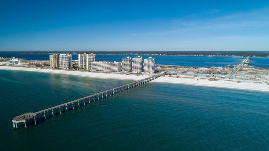 Desirable Navarre Beach, Florida gulf front condo!!!  This unit has all you want for your residence or vacation home, and it provides exceptional rental income!!!    Spectacular views of Gulf of Mexico with this 3 bedroom, 3 bath unit!    Master bedroom overlooks the ocean, with your comfy king size bed.  Two of the bedrooms have king size beds and one of the bedrooms has two twins.  Fully furnished~ open concept from kitchen to living area, large comfortable balcony overlooking the largest fishing pier in Florida!  Wake up to dolphins and sounds of the sea!