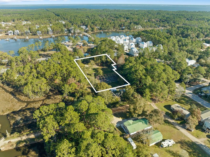 Nestled in the heart of Santa Rosa Beach, this exceptional property features multiple buildable lots, offering prime opportunities for residential development. Free from HOA restrictions, these lots provide a blank slate for creating custom homes that align with modern lifestyles. This rare assembly of lots, with no wetlands, provides the ideal canvas for a visionary development, offering endless possibilities for residential or investment projects in the heart of Santa Rosa Beach. With the area experiencing steady growth and attracting new residents drawn to its natural beauty and convenient location, the appeal of owning and investing in this sought-after area continues to rise. The property does feature a pre-existing concrete foundation and steel framework for a residential home however it was never completed. Permit (# 08-1219) is open and was renewed in 2024. To build multiple lots, buyer would need to subdivide the parcel. Property being sold AS IS. Information contained within this listing such as lot dimensions, is deemed to be accurate but is not guaranteed. Buyer to verify. Additional Parcels available to purchase MLS #: 970731 & 970729.