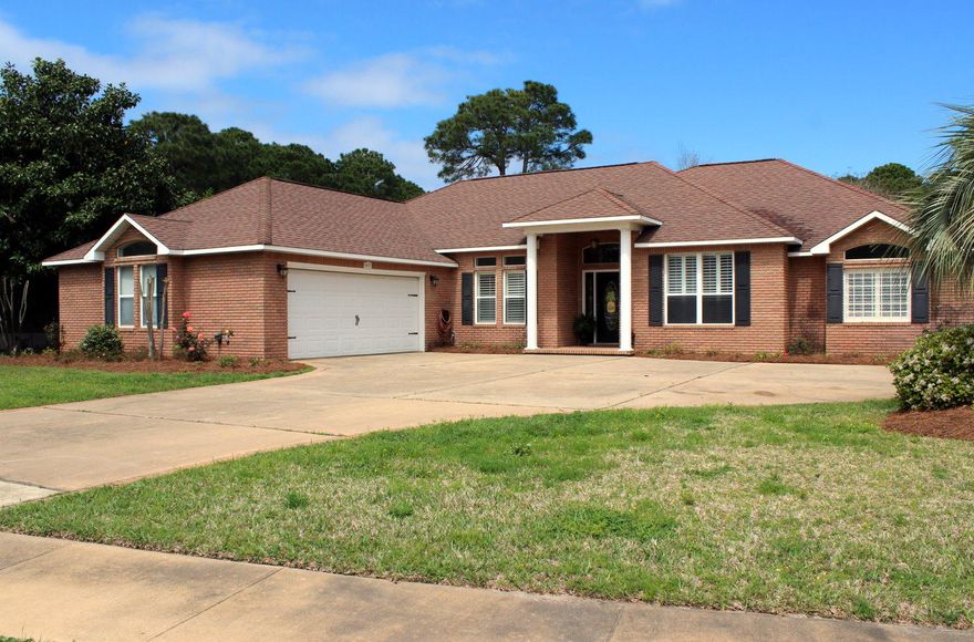 EXTRA, EXTRA - this home is all about the extras - located in Windsor Forest in the heart of Destin. Custom Porcelain throughout the home, carpeted bedrooms. Living room is spacious with tall ceilings and a three-sided gas fireplace. Kitchen has new mahogany cabinets with easy close drawers, granite counter tops,glass backsplash and stainless steel appliances.The heated pool has a spa and the entire lanai is screened-in with large sliding glass doors from the living room and master bedroom. The pool was resurfaced, the enclosure was re-screened, and a new solar hot water heater and energy efficient pool pump were added in 2013. Back yard is fenced, spacious and has numerous fruit bearing citrus trees. A/C replaced in 2011 and is phone controlled, very efficient.