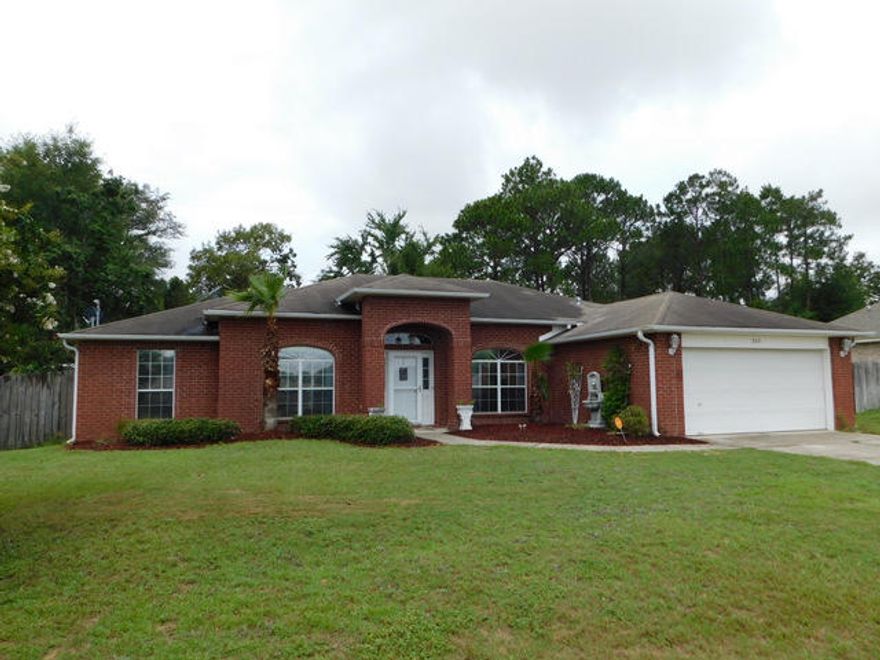All Brick, 4 bedroom home on the south side of Crestview for easy access to the bases, beaches and shopping. This home has many custom features with tiled accents and more. The home has been upgraded with 20 inch porcelain kitchen tiles that flow through the breakfast room, the great room, hallway and foyer. Crown moulding and raised ceilings in many rooms give that spacious feel. The large kitchen has custom tiled back splash, a pantry,and tiled floors.The 4 bedrooms are arranged in a split bedroom floor plan. The Master suite comes with a master bathroom that has a whirlpool tub , tile surrounds, a walk-in shower, walk-in closet, double vanity sinks & a water closet.There is upgraded plumbing and lighting fixtures through out as well.Come & take a look at this home in South Crestview !