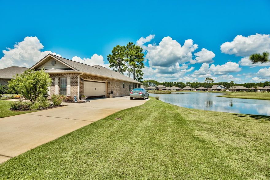 Relax on your screened in porch or huge back patio and look out over the lake. Grab your Paddle Board, Kayak or Canoe and put it in the water right in your backyard. The house has an open floor plan with views of the lake from the kitchen, dining room and master bedroom. A paver sidewalk has been added which connects the driveway to the back patio. Driftwood Estates has a Pool, Club House, Park with Play Ground, Tennis Courts and more. This is a must see property!