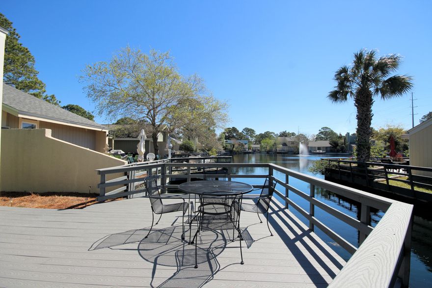 Cozy 3 bedroom, 2 bath home on the water in the popular neighborhood of Linkside. Home features vaulted ceilings, wood burning fireplace, tile throughout, new refrigerator, new microwave oven, new stove, newer HVAC system - 2 years old, generous-sized closets and an exterior storage closet as well. Outside deck was recently redone with Trex decking. Buyers, this home is currently on a vacation rental and could be a turnkey investment property. As an added bonus and to introduce the new owners to the Sandestin lifestyle, the listing brokerage and seller(s) are offering an incentive package to the buyer(s) of this property: Golf for four on one of our three championship courses, a pass for four to Sandestin's exclusive Beach Club, and an introductory membership to the Burnt Pine Golf Club. Sandestin Golf and Beach Resort is a major destination for all seasons and all ages, and has been named the #1 resort on Florida's Emerald Coast. This magical 2,400 acre resort, comprised of over 70 unique neighborhoods of condominiums, villas, town homes, and estates. The resort features miles of sandy white beaches and pristine bay front, four championship golf courses, a world-class tennis center with 15 courts, 4 resort swimming pools (and 15 private neighborhood pools), a 113-slip marina, a fully equipped and professionally staffed fitness center and spa, meeting spaces and The Village of Baytowne Wharf, a charming pedestrian village with events, shopping, dining, family entertainment and nightlife. For true golf cart community living, Grand Boulevard is just outside the resort gates and provides access to additional shopping, dining and entertainment â€“ all without traveling on Hwy. 98.  Come to Play, Stay for Life!