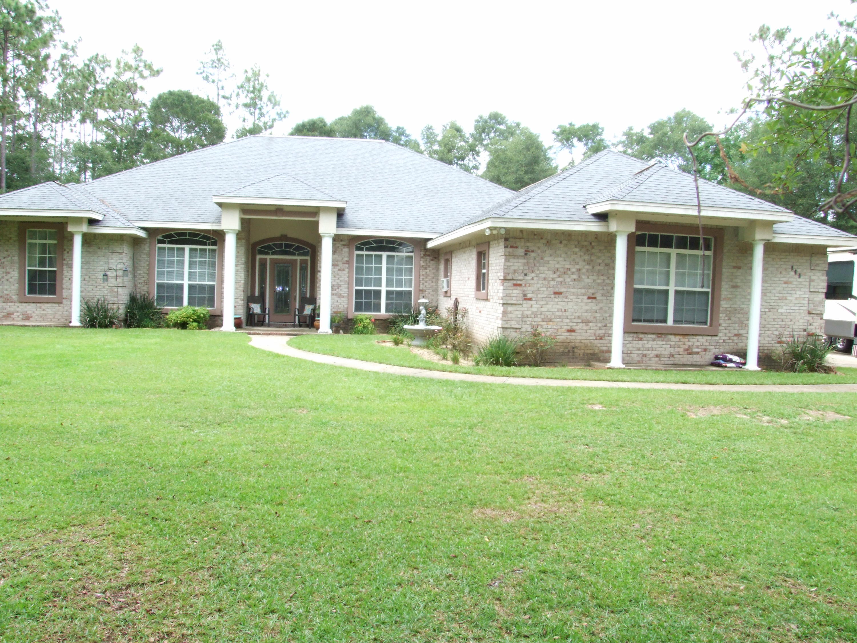 This beautiful country home on secluded 5 acres, built by KGII Builders in 2004, is waiting for you! It is immaculately maintained and turn key ready. A spacious kitchen with hand crafted cabinetry compliments the Uba Tuba Granite countertops. A living area with gas log fireplace and disappearing trifold glass doors leading to the covered patio/pool area that brings the outdoors in for easy entertaining. Oversized master suite, bathroom with marble vanities, walk in shower and 6' jacuzzi tub with white columns that accent this stunning bathroom. You will love the beauty, peace, and serenity this property affords, while being 15 minutes from Crestview. It is just 17 mi. from the 7th Group compound. It is a MUST SEE to appreciate its beauty.