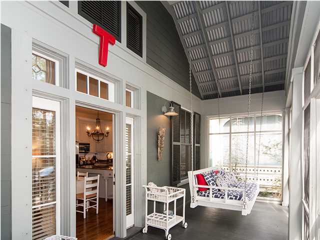 Imagine listening to the waves while relaxing on a swinging bed under the covered, screened porch of this charming WaterColor cottage, situated fewer than 350 yards from the Gulf front Beach Club. Beautiful pine hardwood floors carry throughout this home whose sandy white wood paneled walls create an authentic Old Florida beach atmosphere. A spacious, open floor plan seamlessly connects the living area with the kitchen whose ample, custom perimeter cabinetry and center island are adorned by granite counters.