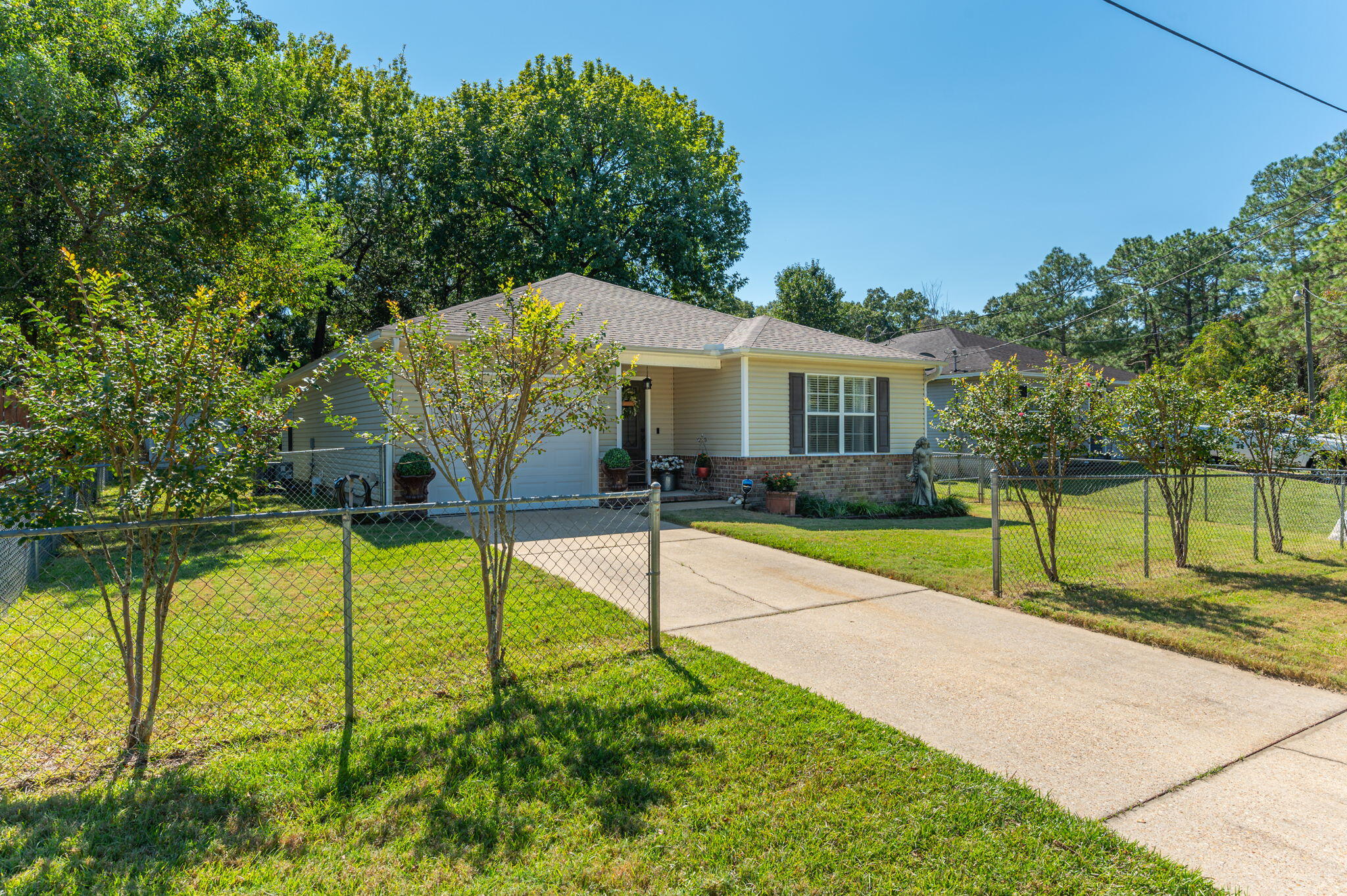 Welcome to this charming 3-bedroom, 2-bath home, perfect for those seeking comfort and style. This inviting property boasts a brand new roof, updated interior with beautiful granite counter tops, stainless steel appliances, and new flooring. With no carpet throughout, this home feels fresh and easy to maintain.Step outside to enjoy the large yard, ideal for outdoor activities, gardening, or simply relaxing. The sprinkler system ensures your lawn stays lush with minimal effort. This home combines modern updates with plenty of outdoor space, making it a must-see!