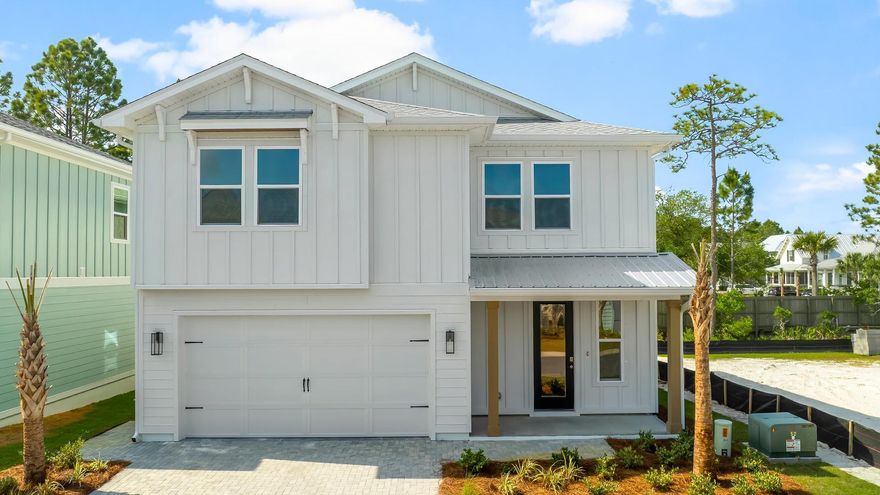 Welcome to 49 Ashwood Drive, a new home at Parkside in Santa Rosa Beach, Florida. This stunning two-story home hosts 2,800 square feet of elegant living space with an abundance of natural light flowing from windows and illuminating the luxurious interior features. Entertain with ease in the open kitchen complete with bar seating, elegant quartz countertops, bright ivory cabinetry, a farmhouse sink, and large corner pantry. The gourmet kitchen has been designed with KitchenAid appliances including a built-in wall oven and microwave as well as a full refrigerator and stove. The main level has a full guest bedroom and bathroom raveling upstairs, you will first see the office or flex room before you find the upstairs family room. The primary bedroom is secluded on a separate side of the second floor and has a private ensuite bathroom filled with luxurious features.  The primary bathroom will feel like a spa retreat with its zero-entry tile shower, a large vanity with two undermount sinks adorned with quartz countertops, a private water closet, and a large walk-in closet with wood shelving. Three additional guest bedrooms can be found on the other side of the second floor along with two full bathrooms, plenty of storage, and a walk-in laundry room. 
Resort style amenities await you at Parkside including a zero-entry pool, pool house with covered outdoor kitchen, outdoor TV, gas-burning firepit, and a scenic boardwalk surrounding an illuminate water feature. Call us today for a tour of this magnificent addition to the quiet west side of 30A.