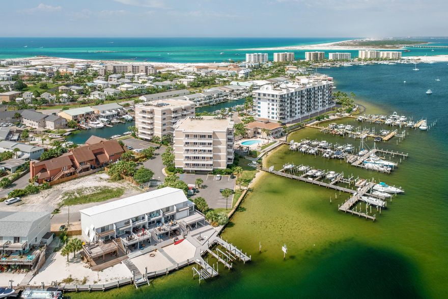This harbor front condo is move in ready & conveys fully furnished. Features all new wood flooring, crown molding, granite counters, custom cabinets, recent HVAC & water heater. Amenities include a beautiful lobby, private marina, harbor side pool, beach access, community room, tiki bar & fish cleaning stations. The buildings at Sun King have undergone a beautiful renovation to include: buildings recoated, painted and sealed, new roofs, hurricane impact windows and doors, new railings, terrace floors resurfaced, elevators & new secure entry gate. The complex boasts beautiful landscaping, plenty of parking, and a private Clubhouse overlooking the harbor for relaxation and gatherings. BOAT SLIPS are assigned on a first come basis by the Dock Master and can accommodate (See More) vessels up to 45 feet. The marina is gated for security, and the end slips are deep water allowing for larger vessels. This is a boaters dream...use of a slip with only the cost of electricity. Go fishing, hit Crab Island, or go to dinner on your boat. If you don't own a boat, call the Destin Water Taxi and they will gladly deliver you to the destination of your choice. Living on the Harbor is a lifestyle. Call and schedule your viewing today. Potential Buyers or their Agents should confirm all information to their satisfaction.