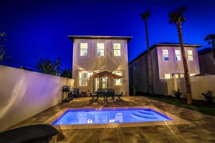 Extraordinary beach home with guest house and private pool perfectly situated on a corner lot for easy access to the beach via Open Gulf St. Featuring 6br, 5 in the main and 4.5 baths, separate guest house complete with 1 bedroom/1 bath & kitchenette. The private courtyard pool & beach access provide the perfect setting for your vacation retreat. Plenty of room for large gatherings. The home features an open floor plan designed w/soft beach colors,a combination of hardwood and tile flooring, SS  appliances & granite w/decorative tile accents. The home is being sold fully furnished & rental ready. Many upgrades/improvements recently. Home is a vacation rental and subject to reservations for 2022. Gross rents 2021: $131,749 w/heavy owner usage.  This meticulously maintained home won't last!