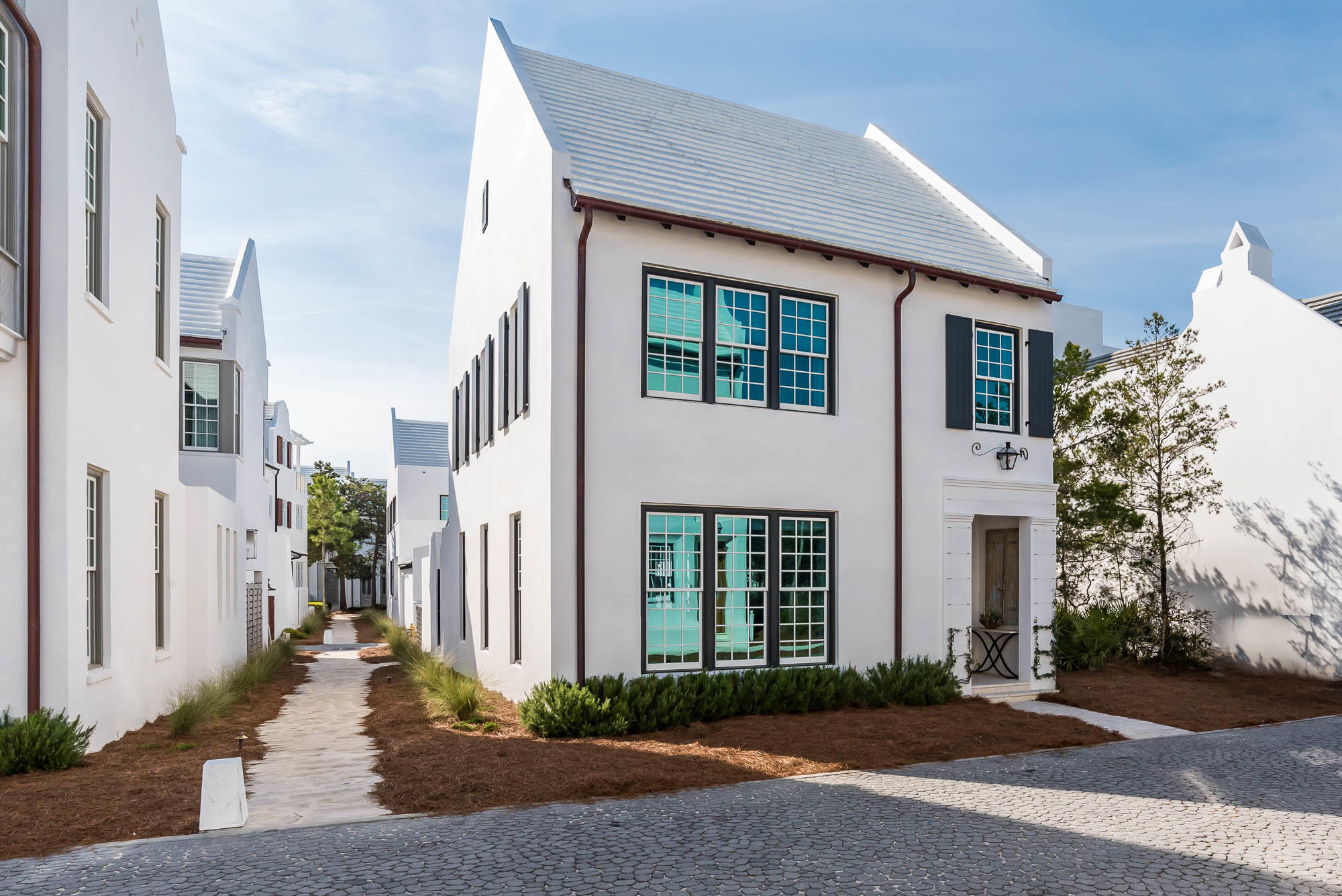 55 Spice Berry Alley is a corner home with a large open floor plan located steps from Caliza Pool and the new Alys Beach Wellness Center, ZUMA. This custom home has 3 bedrooms and 3.5 bathrooms with onsite parking and the option for a future carriage house. Luxury finishes include Pike Road Millwork cabinetry, Ashley Norton hardware, sanded/faux finished wood flooring, EF San Juan custom doors, and quartz countertops. Home is being sold fully furnished.