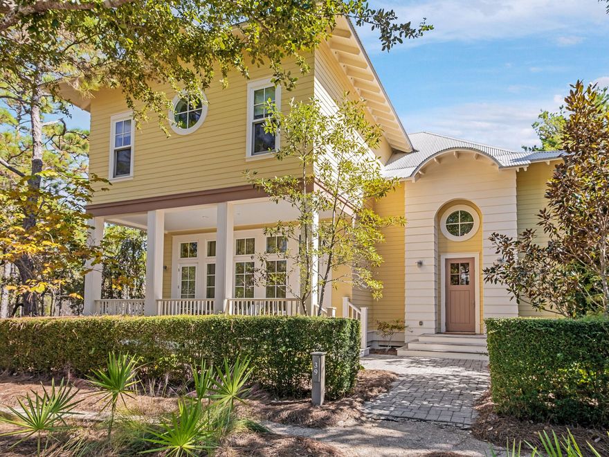 This elegant home rests along WaterColor's quiet northern edge, directly bordering a protected state park and the peaceful pine forest where deer often wander. Designed by architect Dawn Thurber at the owners' request, the home blends her signature touches, such as eyebrow windows and an upper gallery, with a more traditional layout of defined, intimate rooms rather than today's open-concept trend. A welcoming entrance hall leads to the formal living room, framed by glass double doors and overlooking a charming pocket park. Every window along the home's exterior offers calming views of the state forest. A wide hallway opens to a cozy media room anchored by a wood-burning fireplace, flanked by built-ins and a large picture window highlighting the natural surroundings. At the back of the three-bed, three-and-a-half-bath home, a bright professional kitchen features granite counters, ceiling-height cabinetry, and a generous central island with a butcher-block top and seating for family and guests. The formal dining room sits between the kitchen and living room, perfectly placed to frame the serene forest backdrop. A screened porch leads to the outdoor kitchen, complete with a built-in grill, fireplace, and comfortable dining and lounging spaces  ideal for cooler evenings and relaxed gatherings. Outdoors, the backyard is bordered by a 10-foot magnolia hedge with parking for up to five cars. Beneath the carport, a separate space offers valuable flexibility, perfect as a gardener's hut, hobby space, workshop, or anything the next owner wishes to create. Upstairs, the home offers three spacious ensuite bedrooms, each bright, airy, and thoughtfully designed for comfort. The expansive primary suite features two walls of windows, a spacious bathroom with a glass shower and double vanities, and separate his-and-her closets. A laundry room sits conveniently along the upper gallery. Across the home, two additional oversized bedrooms  one currently used as an artist's studio each enjoy private ensuite baths. With 3,452 square feet, a serene setting, and a location just a 15-minute walk to WaterColor's premier amenities  including Camp WaterColor, the Beach Club, Western Lake, and the best of 30A  this home has been lovingly cared for by its original owners and has never been rented. Peaceful, private, and perfectly connected to the WaterColor lifestyle, it offers a timeless retreat at the edge of nature.