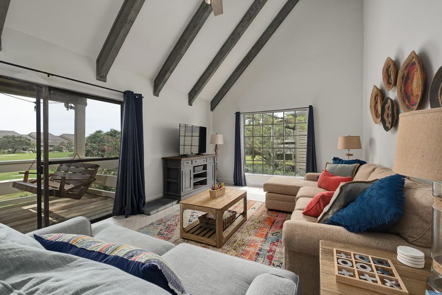 The search is over! This show-stopping unit presents the highest quality renovation in Seascape Condo Garden Villas! Truly a GEM! Like-new condition with floor to ceiling renovations completed in 2017, and recently meticulously furnished and decorated to a very high standard, with newly installed washer/dryer. This condo would make a perfect full-time residence or second-home, or a LUXE vacation rental. ALL THE FEELS! Beautiful esthetics with a designer pallet of colors - cool grays and whites offset with pops of bright colors and textures give this condo a magazine-cover look throughout! The kitchen sets the tone as you enter the condo, with high-end stainless steel appliances, exotic cool tone granite, & custom cabinetry. Herringbone tiled floors & soaring beamed ceilings in Living Area!