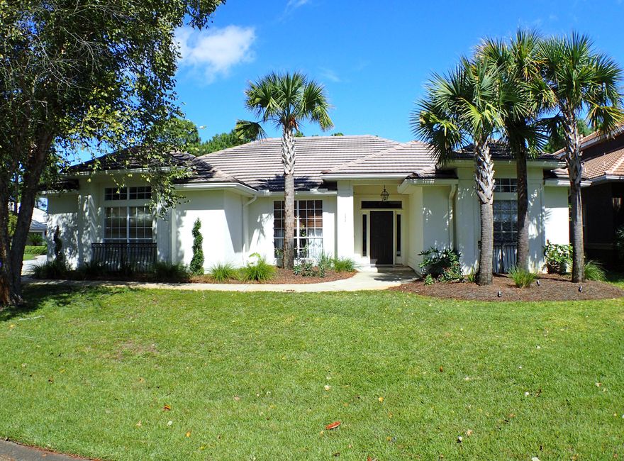 Renovated Home in gated Emerald Bay. Stunning open floorplan home with 3 Bedrooms and 3 full baths plus an office. Homes features: wood flooring throughout, chef's kitchen with large island, high end stainless appliances, luxurious antique brown granite countertops and stone backsplash. Bright open living room with soaring ceilings and walls of windows. 2 spacious master suites each with large walk-in closets,jacuzzi tubs and stand up showers. The wrap around screened in porch is perfect for relaxing. Enjoy a low maintenance home...hard coat stucco exterior and tile roof. Located on a quiet corner lot. Emerald Bay is a gated golf course community. This home does not require flood insurance.