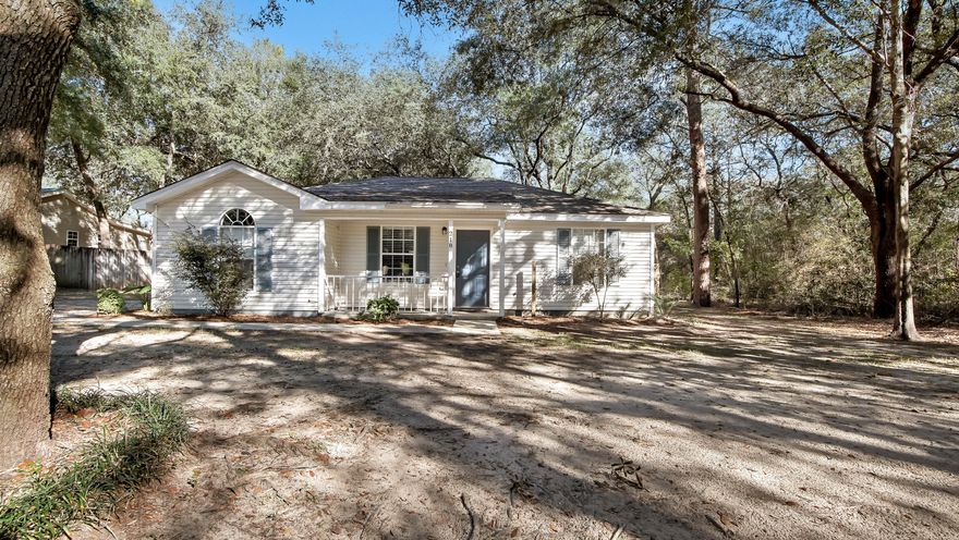 Move in ready! Neat, clean and located convenient to Crestview, DeFuniak Springs & Niceville on Hwy 1087, just a block or so north of Hwy 90 in the Mossyhead area - minutes to I-10. In a beautiful setting, it sits back off the road underneath the canopy shade of mature oak trees. Relax on your front porch or enjoy the fully fenced back yard with new privacy fencing. Inside is all laminate & tile with carpet only in the master bedroom. Galley style kitchen with dining area leading to back patio & yard. Easy maintenance with vinyl siding and 2 year old roof. Qualifies for all types of financing. Seller will include a home warranty up to $500 with full price acceptable offer.