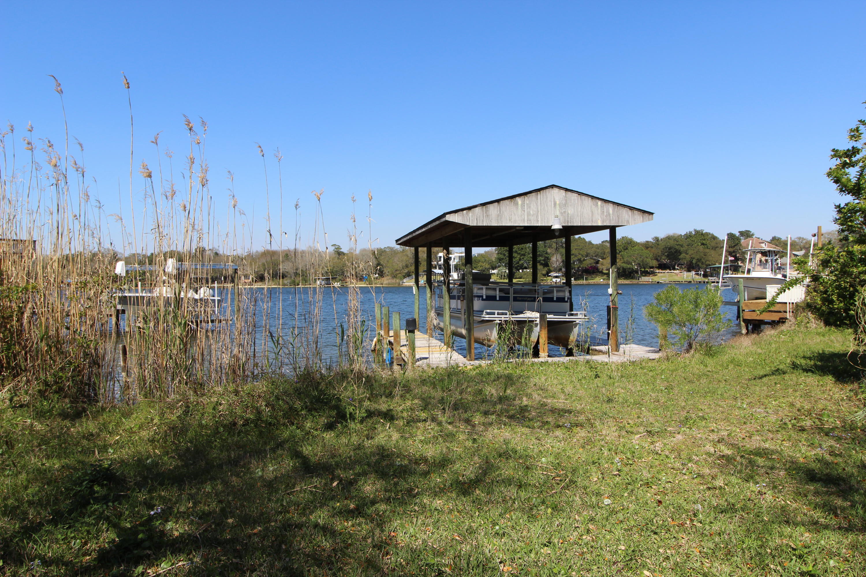 WATERFRONT LOT TUCKED AWAY ON A QUIET STREET IN THE HEART OF FORT WALTON BEACH! Have your boat in the backyard ready for summer fun. Lot has a seawall and a covered boat slip already in place. Bring your builder and design your home on the water. Drive by and take a look today! Seller will look at all REASONABLE OFFERS!
