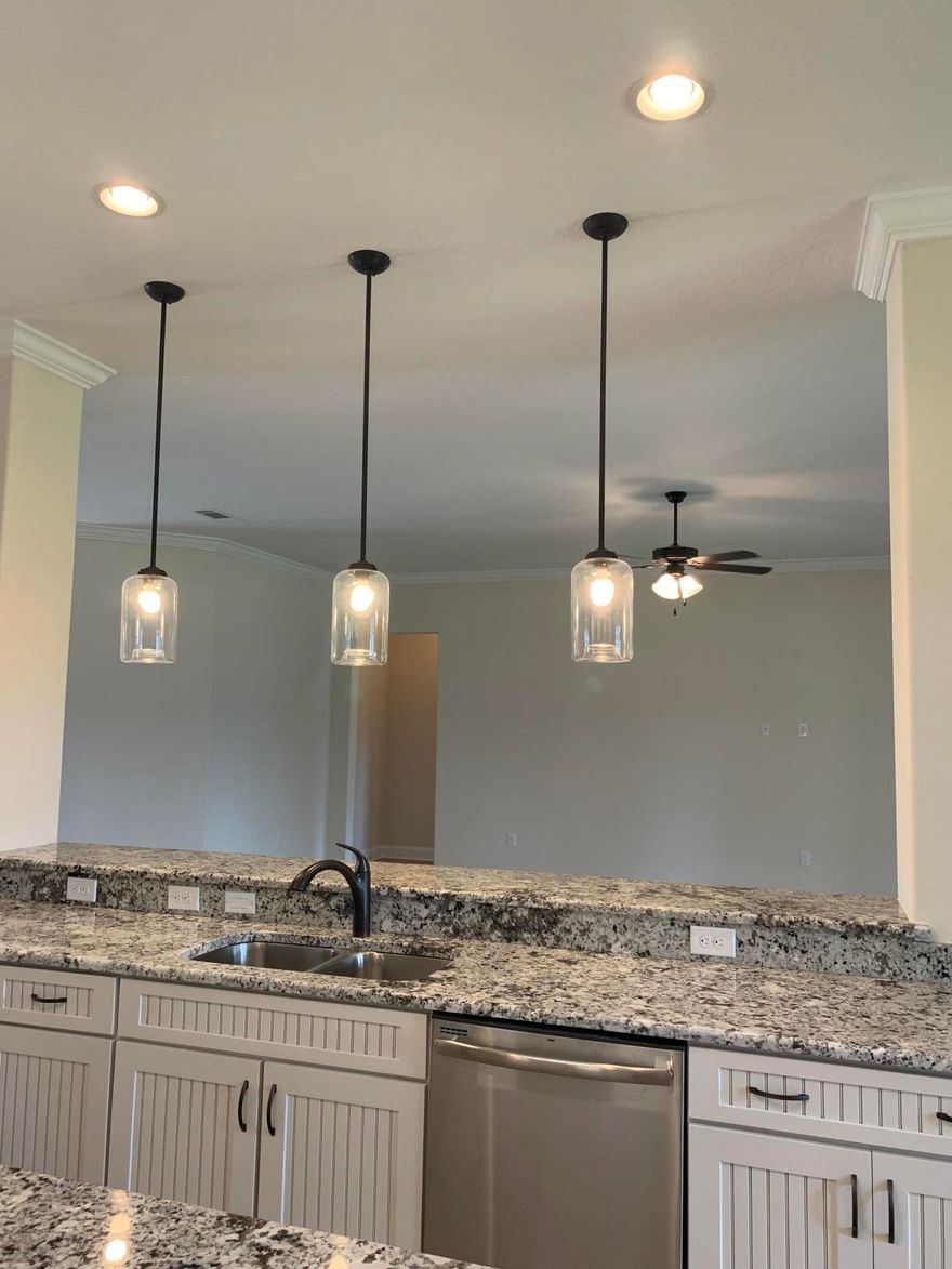 *COMPLETE & READY JANUARY 2022 *UPGRADES UPGRADES UPGRADES *50th Anniversary Collection Celebrates this NWFL Craftsman Builder *4BR/3BA * Raised Ceilings per plan with 8' Entry Doors at Specific Locations * Tile in All Areas Except Bedrooms * Office/Flex Room with 8' Glass French Doors * Crown Molding in Specific Areas * Formal Dining Room * Family Room * Florida/Morning Room * Double Ovens and Smooth, Digital Cook top *Granite Counters * ''Edinburg'' style painted/glazed Maple Cabinets *Over/Under Cabinet Lighting *Apron Sink in Kitchen *Upgraded Kitchen Faucet * Master Bedroom Trey Ceiling *Master Bath includes Tiled Walk-In Shower & Soaking Tub *Square sinks in all bathrooms * ORB Plumbing Fixtures, Door Hardware & Lighting Throughout *2'' Faux wood white blinds (all functional windows)