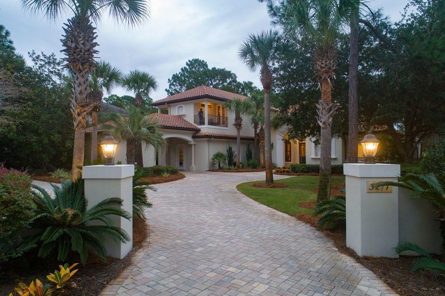 Luxury and elegance in this grand Burnt Pine home are unrivaled for thoughtful style and functional amenities. Renowned builder Maurice Sweet and his high-quality design-build team conceived and crafted this unique, custom home with the discriminating homeowner in mind. The property entrance columns, smooth pavers, covered parking, oversized two-car garage and an additional golf cart garage, intriguing architectural lines and clay tile roof evoke a stately presence with a hint of Mediterranean influence. Sherwin-Williams Loxon exterior paint carries a 10-year warranty right into year 2026. The grandeur inside is replete with angled walls, wood accents, tray ceilings, a built-in home office and a guest room with custom alcoves doubling as sleeping or reading nooks and two private porches.