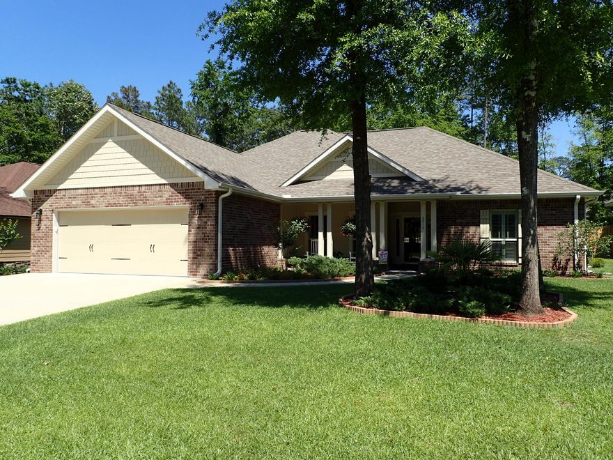 Stunning, Gorgeous, Beautiful. Words that just begin to describe this extremely attractive and exquisitely maintained home. Love and attention to detail exude over every inch of this property! Newly built in 2011 this 2255 SF home has 4 bedrooms in this split bedroom design and 3 and 1/2 baths. Large open great room allows viewing of kitchen from living room, breakfast nook, formal dining area and tucked just off the laundry area is a home office area. This all brick home is meticulously maintained and has upgrades including screened lanai, sidewalk on side of home, seamless gutters, fenced back yard, stained concrete floors and more. Interior shutters adorn the windows fully cased windows in the great room and dining area. This is a MUST see!! Call today before this home is gone!