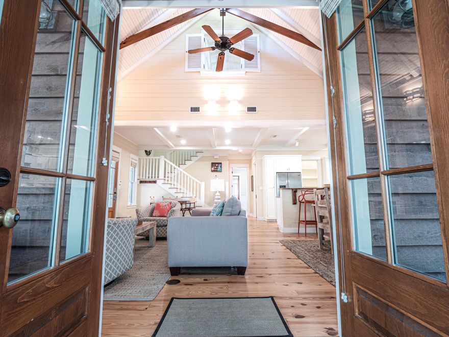 This ''PERFECT BEACH COTTAGE'' is located in the coveted ROSE GARDEN MEWS neighborhood of WaterColor in Phase I.   This beach cottage has the ideal location with a short stroll to either the Lake House Pool or to the emerald green waters of the Gulf of Mexico and the newly expanded WaterColor Beach Club - with three pools - on the Gulf and the shops and restaurants in WaterColor's town center.  As you enter this striking beach cottage you immediately feel the openness, yet the warmth and coziness of this cottage is enchanting. The soaring Cathedral and beamed ceilings offer an open feel to the living room, dining room and kitchen. Enjoy the view of Crimson Park from the kitchen, living room and dining room through 3 sets of beautiful French doors. The French doors and large cottage windows