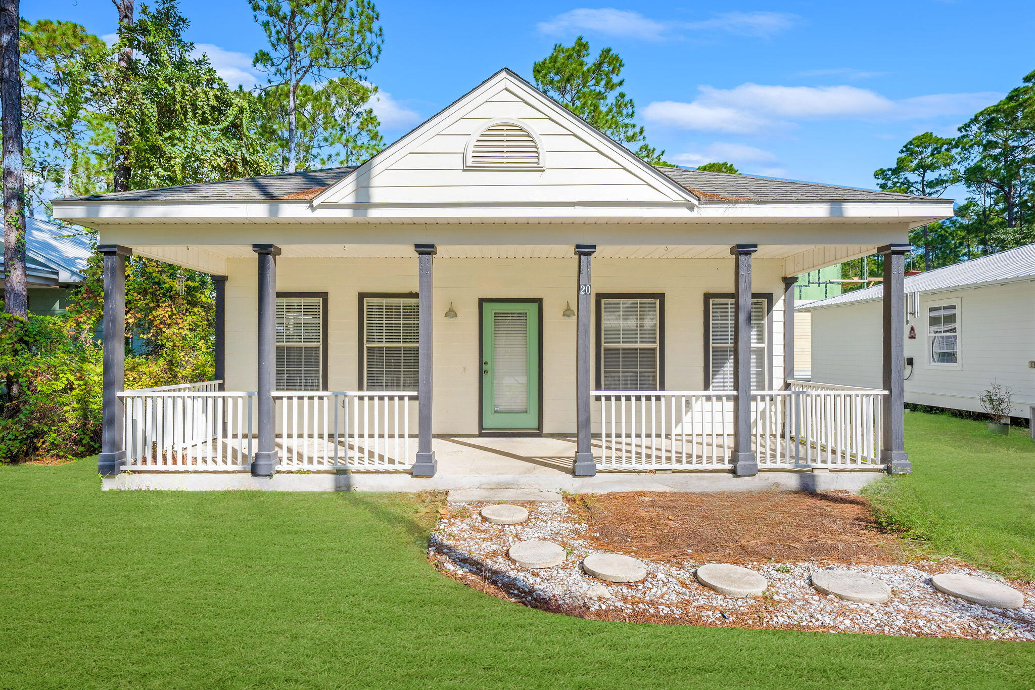 Nestled in the peaceful Magnolia Beach neighborhood of Pt. Washington, this charming Florida cottage at 20 West Wild Blueberry Way is just a short stroll from Choctawhatchee Bay. Enjoy quick and convenient access to biking and hiking trails, renowned Scenic Highway 30A, and the pristine beaches and attractions of South Walton. Set on an oversized lot, this inviting 3 bedroom, 2 bathroom home offers 1,338 square feet of living space. The open concept floor plan boasts abundant natural light, cathedral ceilings, and maple cabinetry, creating a bright and airy atmosphere throughout. Key features include: Spacious Primary Bedroom with soaring 14 foot ceilings, recently refreshed interior and exterior paint, updated flooring and HVAC system, and generous front porch and screened in back porch.