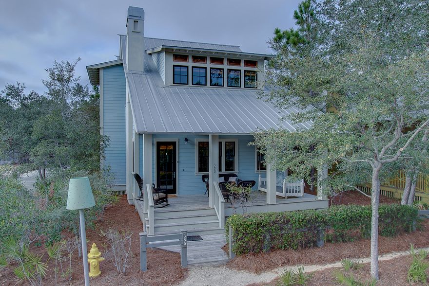 Incredible custom home designed by Duncan-Nequette Architects and built by Velvet Sun Builders nestled across the street from Woodfern Park and Camp Watercolor. Situated on a corner lot, this beautiful 4 bedroom home plus carriage house and 2 car garage sleeps 15 people comfortably. With an open living concept, this builder's personal home includes 3 fireplaces, 3 porches of which 2 are screened in, and Subzero and Wolf appliances. The tongue and grove walls and ceilings and heart pine floors and beams add warmth and character throughout the house. This home has a proven rental history and is projected in 2017 to bring in 100k in rental income. It easily accommodates 2 families and has been a long time favorite of many repeat guests. For more details, please see the attached supplement. Each of the four bedrooms have televisions and a full bathroom and closets with ample storage space. Master bedroom located on the second floor has a brand new king upholstered bed, a large walk-in closet and a linen closet. The bathroom has separate vanities, a large walk-in shower with multiple shower heads and a beautiful claw foot tub. The large screened porch located off this room and equipped with a fireplace further enhances the tranquility of this master suite.

The second master is located on the second floor and is very generous in size. It has a king bed and a beautiful bathroom with the shower equipped with a spa-like rain shower head.

The third bedroom, also located on the second floor, consists of three built-in bunk beds with TVs, two closets, and a full bathroom.

There is a cozy TV area on the second with a pull-out sofa which will easily accommodate two children or one adult. This area is the perfect place for children to gather when they need a little space of their own.

The kitchen and dining area are open and inviting for large groups. The table easily seats 8-10 and the kitchen island has two stools providing two more seats.

There is also a bedroom located on the first floor. It has a king bed and a full bathroom with a walk-in shower.

On the front of the house, there is an expansive porch with a cozy bed swing and lots of other seating options. On the back of the house, there is another screened porch with a grill, fireplace and a table to enjoy meals and congregation.

The house boasts a gorgeous carriage house over the two car garage. There is a complete kitchen, large bathroom with walk-in shower, three closets for ample storage, a king bed, and a set of bunks with a trundle accommodating up to five people.

This home is perfect for any family or easily accommodates two families with its ability to sleep 14-15 people comfortably. This home has strong rental history and projections and has been a long time favorite of many repeat guests especially since it can typically handle two families.

As the home was built for the builder, it is charming, unique, and built with all the special touches and high quality finishes you would expect with a builder's personal home. Whether you spend your days reading on one of the three porches or find yourself rinsing off at the outdoor shower after a long day at the beach, this beautiful home will surely live up to it's name, Making Memories.