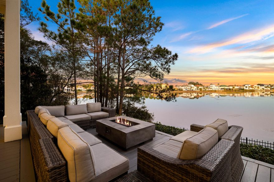 This exceptional three-story lakefront home in the gated community of Destiny West offers breathtaking water views, luxurious finishes and a perfect combination of comfort and sophistication. Designed for those seeking a primary residence, second home or premium vacation rental, this beautifully maintained four-bedroom, four-bathroom retreat provides an elevated coastal living experience just moments from the beaches of Destin.  From the moment you step inside, floor-to-ceiling windows showcase sweeping lake views, filling the open-concept living, dining, and kitchen areas with natural light. High-end details, including custom woodwork, chandeliers and rich hardwood flooring, create an inviting yet refined atmosphere. The gourmet kitchen features granite countertops, custom cabinetry and premium appliances, while the spacious living area, complete with a fireplace and motorized window treatments, is ideal for relaxing or entertaining.  

The second-floor primary suite offers a private retreat with a separate spacious balcony, a fire pit, a spa-like ensuite bath, and a generous sized walk-in closet with custom built ins. The third floor is a versatile space with a king bed, ensuite bath and kitchenette, making it ideal for guests or a multi-purpose retreat.  

The backyard terrace is a showstopper, featuring a fire pit and panoramic lake views, creating the perfect setting for evening gatherings. Inquire within for ideal private pool plans and renderings. With proximity to James Lee Park and pedestrian & golf cart friendly Scenic Highway 98, this home offers the best of the Emerald Coast lifestyle, whether as a full-time residence or an income-generating vacation rental.  

The gated Destiny West community further elevates the living experience with its verdant landscaping, a large, seasonally heated swimming pool, hot tub, fitness center, tennis court, and a grand clubhouse. Landscaping is paid quarterly to the association so no need to bring your lawn equipment. 

Perfectly positioned and meticulously upgraded, this home is a rare opportunity to own a premier lakefront property in one of Destin's most sought-after communities.