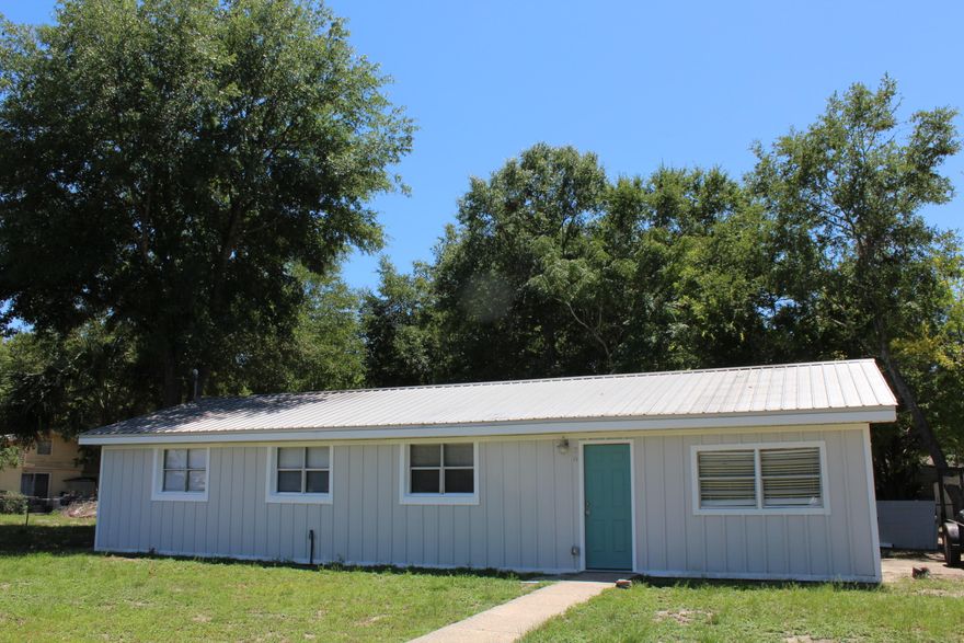 Come view this beautiful fully renovated, centrally located home! Metal Roof! Upgrades include a new HVAC system (2020), new exterior and interior paint, new blinds, new copper wiring (2020), lighting including sconces, ceiling fans, pendant and recessed, new smoke detectors, new bathroom vanity and mirror, fencing refurbished, and brand new luxury vinyl plank flooring. The kitchen includes all new cabinetry, stainless and black stove and built in microwave and dishwasher, all new faucets and fixtures, disposal, tiled back splash and white quartz counter tops. The home also features new base molding and trim throughout. Corner lot with two sets of double gates to back in boats and trailers or multiple vehicles. Hotwater heater 2020. Laundry closet is next to kitchen! Vaulted ceilings in the kitchen with ship lap. In addition there are new barn doors separating the kitchen and dining room from the living room. There is a sliding glass door and a side concrete patio. Buyer to verify all dimensions and information.