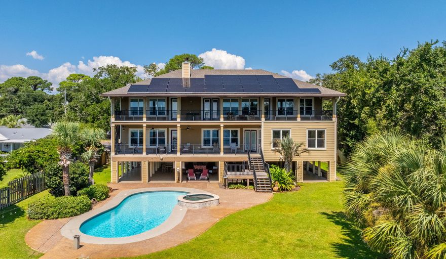 Resort-Style Living on the Intercoastal SoundThis remarkable 6,287 sq ft, 5-bedroom, 6.5-bath estate offers the ultimate lifestyle with 123 feet of deep-water frontage in the sought after Elliott Point neighborhood.Brand-new 2025 solar panel system with energy savings at just $0.13 per kWh  with a professionally maintained solar and battery system. designed to significantly reduce monthly energy costs while providing reliable backup power during outages. The existing solar agreement (TPO) is fully transferable to the new owner, offering continued energy sustainability, and long-term value and efficiency.From the moment you step through the double doors,  Soaring beamed ceilings and a sweeping wrought-iron staircase set the stage for timeless elegance. The expansive Great Room features large impact-resistant windows, flooding the space with natural light and showcasing panoramic views of the intercoastal waters.

The chef's kitchen is designed to impress, complete with custom cabinetry, professional-grade Thermador appliances, dual gas ranges, three ovens, a warming drawer, two dishwashers, an ice maker, and 2 beverage coolers perfect for both grand entertaining and day-to-day convenience. Just beyond, oversized waterfront decks extend the living space outdoors, offering the perfect backdrop for dining, relaxing, or taking in the panoramic sound views.

The main-level primary suite is a private sanctuary with breathtaking waterfront views. This expansive retreat features a spa-inspired bath with a large air jet tub, oversized steam shower, and exquisite finishes. His and her dual vanities and two extraordinary walk-in closets, each designed on a grand scale, provide unmatched space and relaxation leading to the large, oversized back porch.

Three of the home's bedrooms are positioned directly on the Intercoastal Sound, each designed as a private master suite with extraordinary water views with the main master being on the main all capturing the stunning waterfront backdrop. A spacious media room also overlooks the Intracoastal Sound, creating the perfect setting for entertainment with a view.

Outdoors, the property is a true retreat with a refinished pool and spa [with new heater in 2024 and 2 new pumps], multiple lounging areas, and a beautifully updated dock. The reinforced pilings, new electrical, and 16,000 lb. boat lift make it ideal for boating enthusiasts. The dock is outfitted with two wave runner lifts perfect for enjoying a full day on the water. 

Beneath the home, you'll find a versatile lower level featuring a spacious garage, large workshop, and full pool bath. Extra storage space is perfect for water toys, tools, and hobbies, while offering effortless access for poolside entertaining. An extra-large motorhome/RV pad with full hookups (water, power, and sewer drain) provides convenient accommodations for large RVs, motorcoaches, or guest vehiclesan exceptional addition for travelers and guests.


Recent upgrades ensure peace of mind and efficiency, including a new roof (2024), 4 complete HVAC replacements [inside and out with UV lights and Dehumidifier] (2021), and a 39-panel solar system with battery backup (2025) under a transferable fixed-rate contract. Additional features include 4 Blink digital security cameras and an irrigation system with a new pump perfect for both grand entertaining and day-to-day convenience. Just beyond, oversized waterfront decks extend the living space outdoors, offering the perfect backdrop for dining, relaxing, or taking in the panoramic sound views.

The main-level primary suite is a private sanctuary with breathtaking waterfront views. This expansive retreat features a spa-inspired bath with a large air jet tub, oversized steam shower, and exquisite finishes. His and her dual vanities and two extraordinary walk-in closets, each designed on a grand scale, provide unmatched space and relaxation leading to the large oversized back porch.

Three of the home's bedrooms are positioned directly on the Intercoastal Sound, each designed as a private master suite with extraordinary water views with the main master being on the main all capturing the stunning waterfront backdrop. A spacious media room also overlooks the Intracoastal Sound, creating the perfect setting for entertainment with a view.

Outdoors, the property is a true retreat with a refinished pool and spa, multiple lounging areas, and a beautifully updated dock. The reinforced pilings, new electrical, and 16,000 lb. boat lift make it ideal for boating enthusiasts. Beneath the home, you'll find a versatile lower level that includes a separate garage, a spacious workshop, and a full pool bath perfect for storing water toys, pursuing hobbies, or enjoying effortless access while entertaining by the pool.

Recent upgrades ensure peace of mind and efficiency, including a new roof (2024), 4 complete HVAC replacement (2021), and a 39-panel solar system with battery backup (2025) under a transferable fixed-rate contract. Additional features include 4 Blink digital security cameras and an irrigation system with a new pump.

With its rare combination of size, luxury, and thoughtful updates, this estate offers the perfect balance of elegance, comfort, and functionality this home is truly a private resort on the water!
