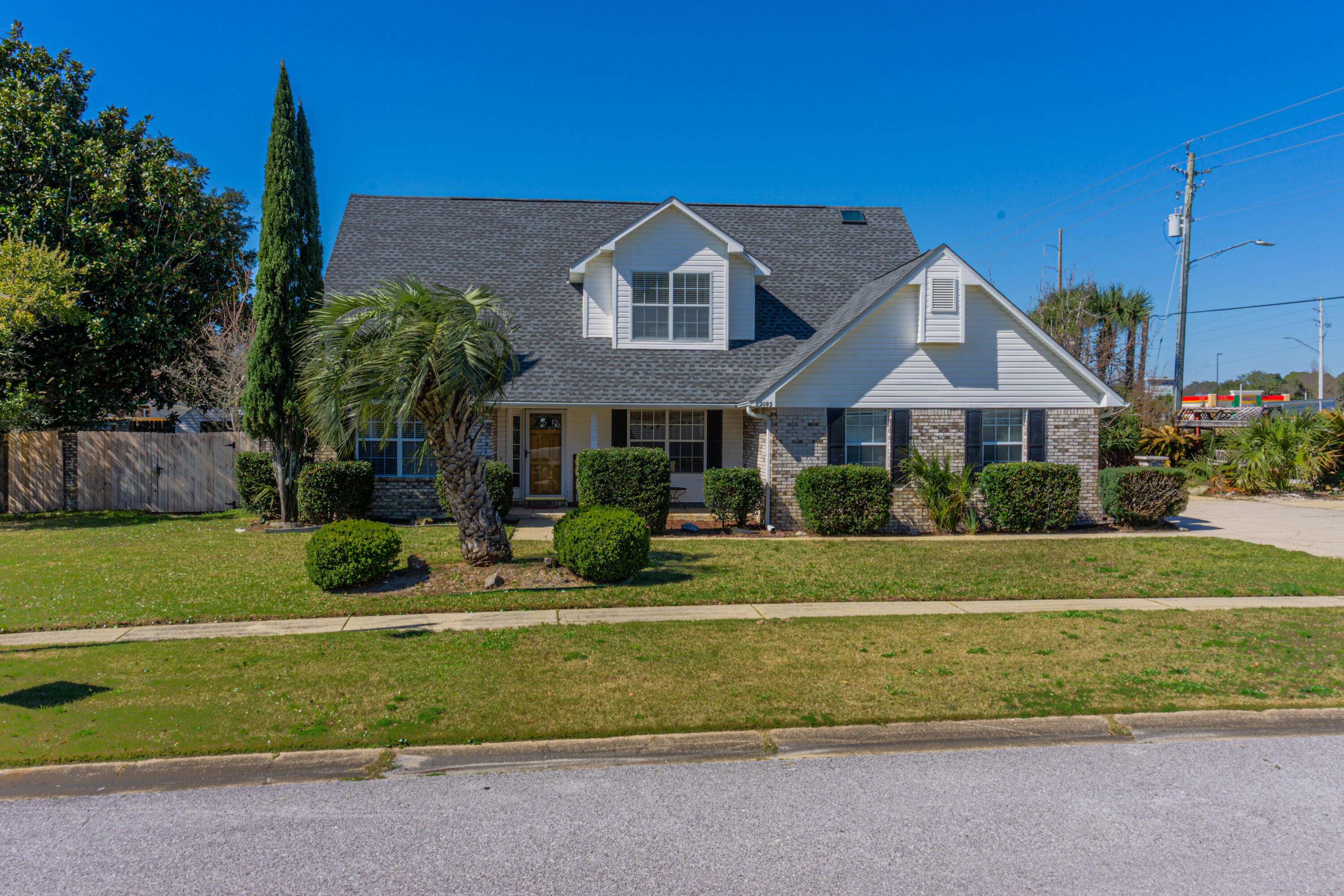 This Custom home with fabulous curb appeal in a highly sought after waterfront community, offers deeded access to the Santa Rosa Sound with a sandy beach and picnic area, plus is only 7 miles to Hurlburt! Tons of natural light fills the living room featuring cathedral ceilings and fireplace. The kitchen has stainless appliances, including a gas stove; granite counters, walk in pantry and an Island with breakfast bar. The downstairs master includes a Jetted tub, wall-mounted electric fireplace, separate shower, dual vanities and 2 walk in closets. The formal Dining room, Office, Laundry and half bath round out downstairs, whilst the two remaining bedrooms and guest bathroom are upstairs. A delightful fenced yard with sprinkler system, fruit trees and a 2023 Roof make this home a must see! The low HOA dues include Deeded Access to the Santa Rosa Sound. A boardwalk leads to Pritchard Point's Private Beach where you can chill out, grill and admire the wonderful views and amazing Florida sunsets. The neighborhood also boasts sidewalks, streetlights and underground utilities, is ideally located just a hop, skip and jump from the new Publix, and less than 10 minutes to beautiful Navarre Beach. New Garage door and opener 2024. Home is located in Flood Zone X.