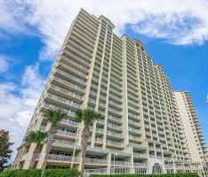 NEW REDUCED PRICE!!! Your opportunity is here to own this two bedroom, two bath, fully furnished condo in the highly desired Seascape Resort!!! Located on the 4th floor with an oversized balcony where you can enjoy stunning views of the gulf and lake. This unit offers a HALO automatic water sensor shut off system, to prevent major water damages in the event of a water leak. The unit features 9 foot ceilings, ceramic tile in all areas except the bedrooms making it easy for maintenance, granite countertops,stainless steel appliances, laundry room, and an outside storage/owners closet. Enjoy the resort style amenities including: 24,000 sf of pools (4) with seasonally heated areas, on site restaurant ''Cabana Cafe'' 18 hole on-site golf course, tennis courts, and 2000 feet of deeded beach.
