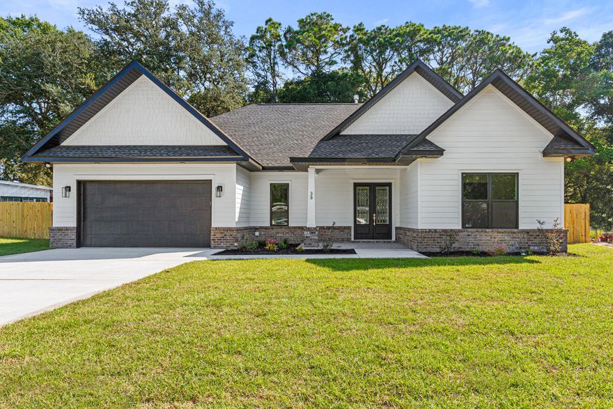 Discover contemporary elegance in this newly constructed Elliott Point masterpiece, featuring 4 bedrooms, 3 bathrooms, and 10-foot ceilings. This 2,215 sqft open-concept home boasts impact-resistant windows and doors for energy efficiency and storm safety, plus advanced soundproofing in interior and exterior walls for ultimate tranquility.The gourmet kitchen dazzles with upgraded granite countertops, abundant cabinetry, a gas cooktop with vent hood, stainless steel appliances, and a natural gas tankless water heater for endless hot water. The luxurious master suite includes a curb-less walk-in shower with dual heads, dual vanities, a freestanding tub, and a custom-built closet with shelves, display boxes, and drawers. All bedrooms feature similar custom closet designs for ample storage.

Step through double French doors to a spacious covered patio, perfect for hosting lively gatherings or savoring quiet evenings in your private, 0.25 acre fenced backyard. Equipped with cable TV hookups and a gas stubout for a fireplace or grill, this outdoor oasis is designed for year-round enjoyment.

Nestled in the vibrant, golf cart-friendly Elliott Point community, this home offers easy access to Ferry Park's premier amenities, including tennis and pickleball courts, a one-mile walking trail, a children's playground, and more-all just steps away. Enjoy nearby top-rated schools, charming shops, and delightful restaurants.

Schedule your private tour today to experience its modern elegance and vibrant community before it's gone.
