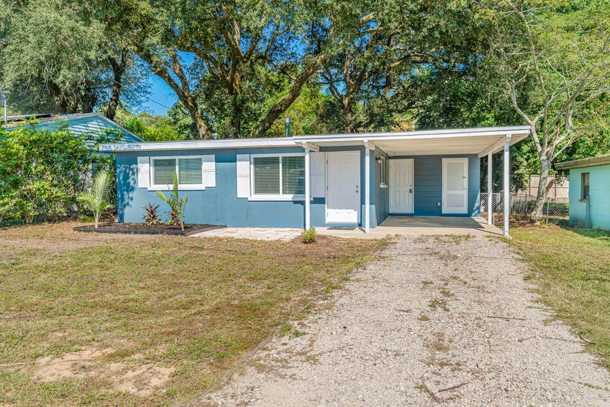 Charming 2-bedroom, 1-bath cottage in the heart of Niceville. This single-story home features stylish blue plantation shutters, a single-car carport with additional parking, and a large fenced-in lot with mature trees and tropical landscaping. Inside, you'll find ceramic tile throughout, upgraded blinds, and a renovated kitchen with maple cabinetry and a dedicated dining area. Both bedrooms include built-in storage above the closets. The retro bath adds character, and the bonus storage room off the carport provides extra functionality.