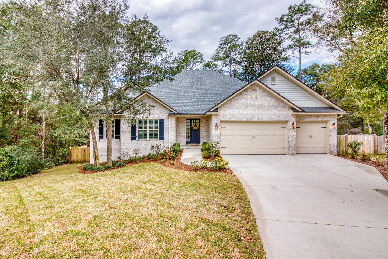This Swift Creek home will truly impress you. It is located in a cul-de-sac and from the moment you open the front door you will be charmed by all of the upgrades and character. The enormous foyer greets you with shiplap walls, reclaimed wood arches, designer lighting, and that is only the beginning. The large open living room with lap and gap ceilings is built for entertaining and adjoins the gourmet kitchen. The kitchen is impressive with a Wolf Gas Range built into a massive custom island topped with beautiful quartz counters. The high end appliances are not the only impressive feature, there are also custom open shelves to give the kitchen additional charm. This kitchen will certainly be a gathering area at every entertaining event and just wait until you see the custom pantry!