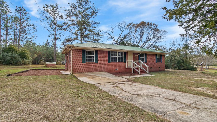 Rare find of a 4 bed/2 bath brick home in a great neighborhood - Ten Lake Estates. Sitting on nearly 2 acres! Open floor plan with laminate and tile flooring throughout. Other updates have been done over the years, including kitchen and bath renovations. The garage was converted into a master bedroom with tile shower and combination laundry space in the master bath. The dining area leads out the french doors to the open back patio and yard. With nearly 2 acres, there is amazing room to create a back yard of your dreams. Membership in HOA is optional - by joining you have access to the lakes for fishing, etc.