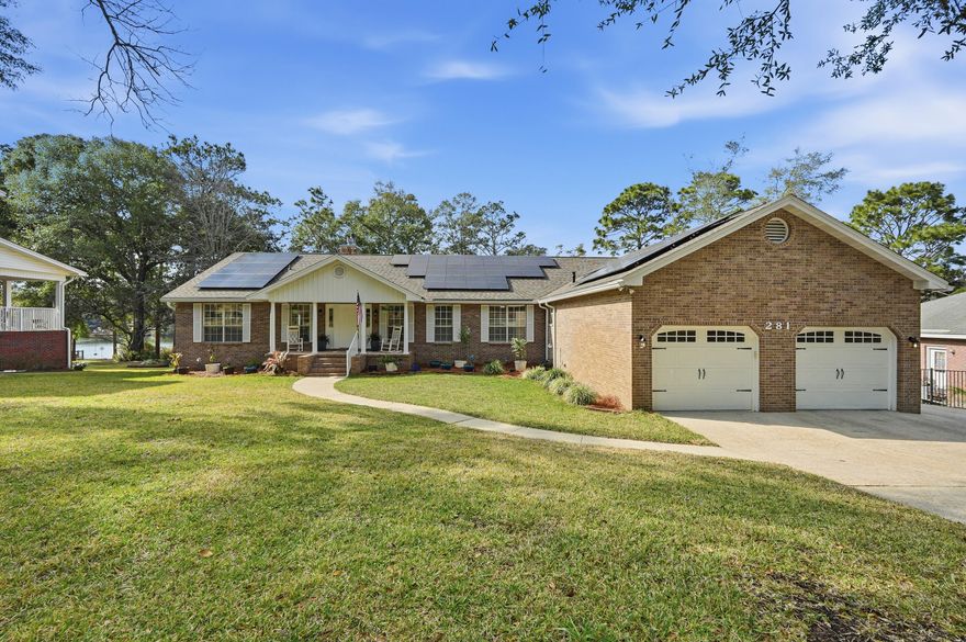 Lakefront living in Rocky Bayou Estates! This spacious home sits on beautiful Lake Henderson and offers stunning water views from most rooms. The main level features 4 bedrooms, 4 full baths, a private office, Florida room, and a cozy sitting room off the primary suite. The living room impresses with a gorgeous beamed ceiling, and all bathrooms have been fully renovated. Downstairs includes 2 additional bedrooms, a full bath with laundry, plus a full kitchen and living room, AND a woodworking shop,--ideal for guests or multi-generational living. Enjoy private decks on both levels, paid-off solar panels (at closing) for low utility costs, and a 2022 roof for peace of mind. Home is also equipped with a central vacuum system. A rare lakefront gem! Washer and dryer downstairs will convey.